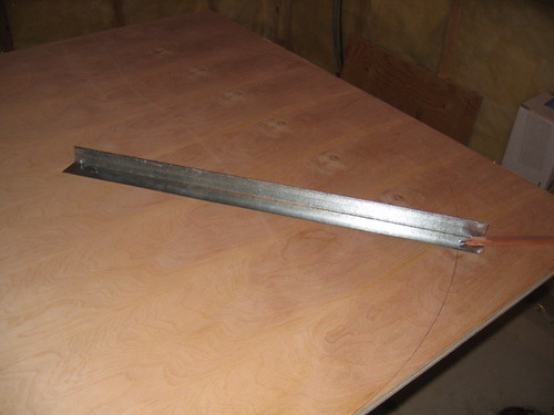 Additional workshop view of cut the baseboard and raceway (photo 2) during a DIY poker table build